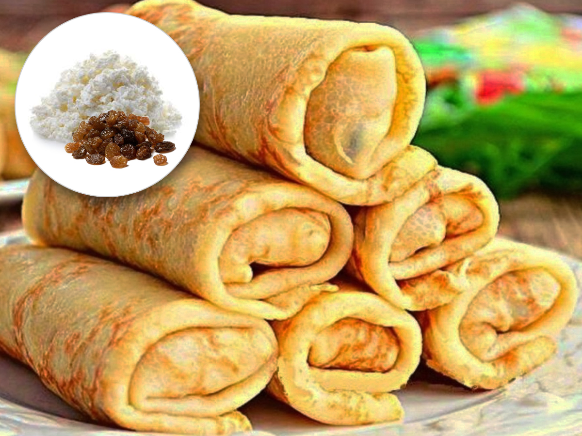 Млинці с сиром та родзинками Фото: Млинці с сиром та родзинками